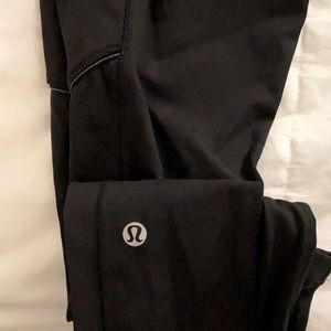 Black Lululemon running leggings with silver accent on pockets in a size 4
